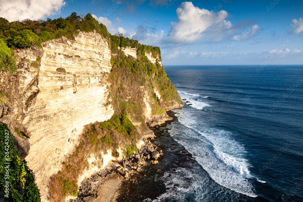 Bali Cliffs in Indonesia with Waves Crashing Against Rocks