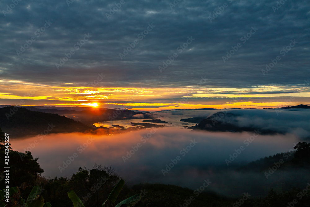 Sunrise and Fog Over the Hills in Thailand Near Mekong River and Loas