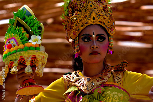 Balinese woman dancing Tari Pendet Dance in Bali Indonesia photo