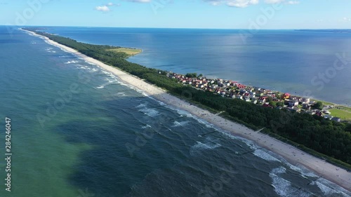 Beach in beautiful city Chalupy resort in Poland. Aerial video. Baltic Sea.Waves coming in. photo