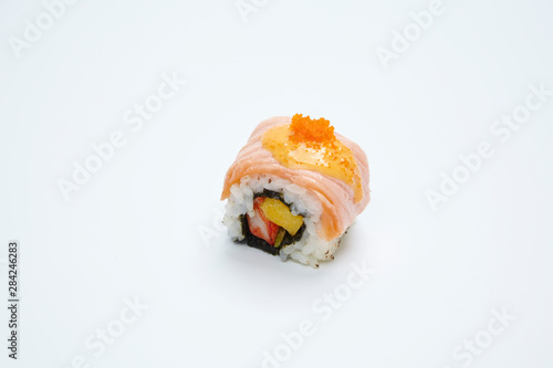 Philadelphia Maki Sushi made of Fresh Raw Salmon on white background.