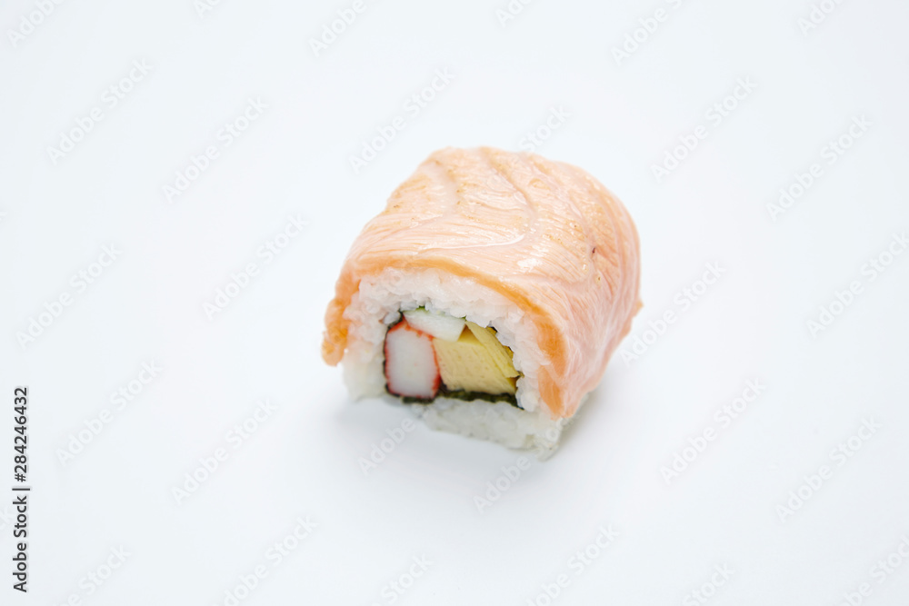 Philadelphia Maki Sushi made of Fresh Raw Salmon on white background. Philadelphia Maki Sushi made of Fresh Raw Salmon on white background.