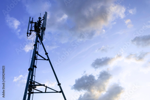 Silhouette of telecommunication tower of 4G and 5G cellular, mobile and internet station tower in sky background.
