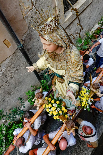 Syracuse, Sicily, Italy A Madonna statue is carried on a back alley of Ortygia island on Ferragosto, (Assumption Day) on.August 15 to celebrate this mid-summer holiday.