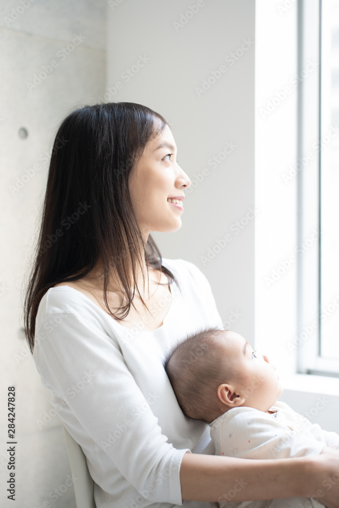 Young mother holding her baby