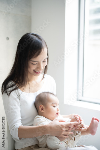 Young mother holding her baby