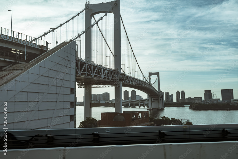 Fototapeta premium Rainbow bridge and elevated monorail road in Tokyo