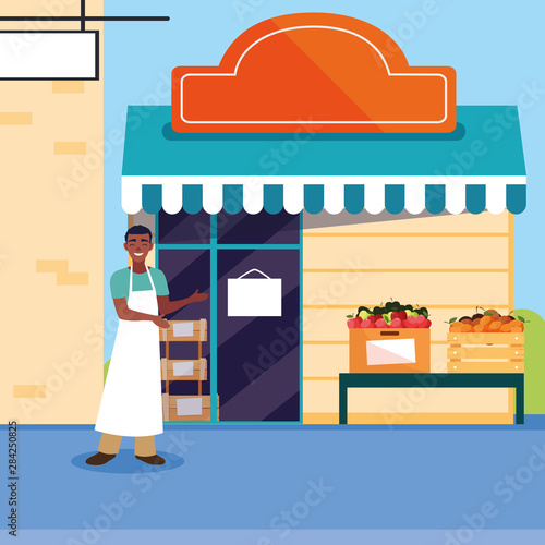 salesman with fruits store facade building