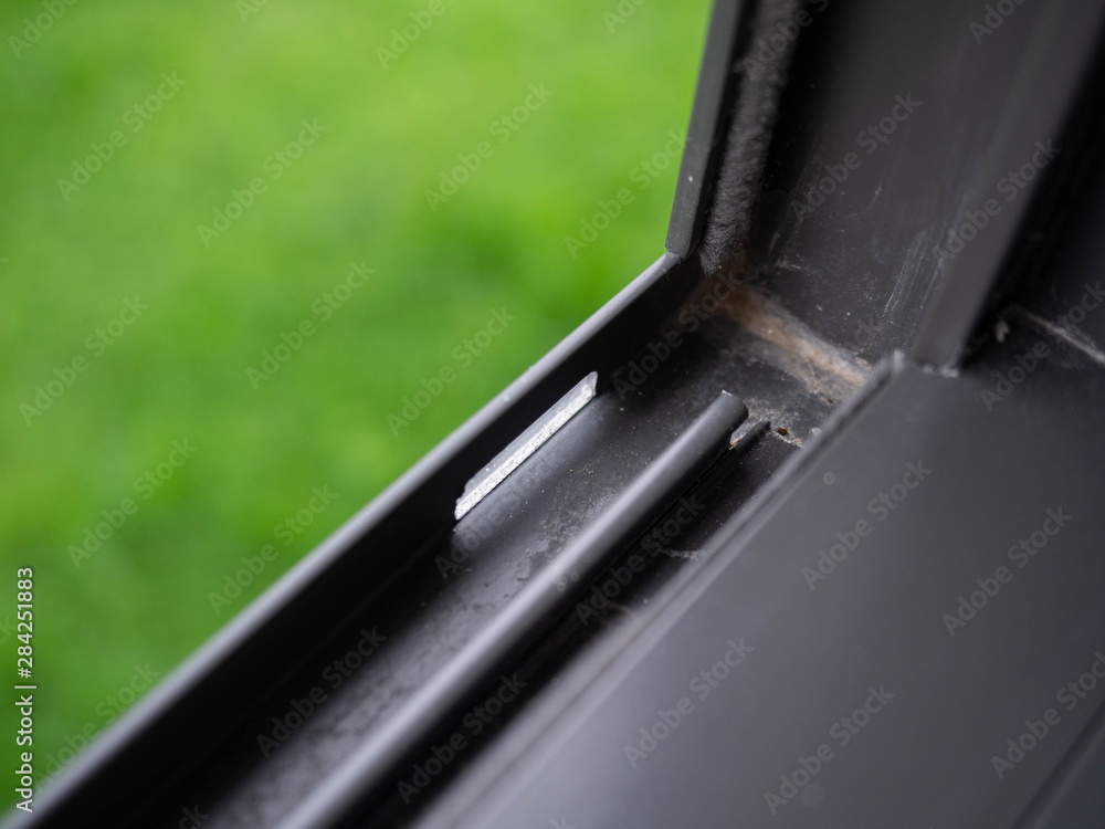Modern Black plastic window sill,background grass green,Shining Modern Black plastic window sill,background grass green,Shining