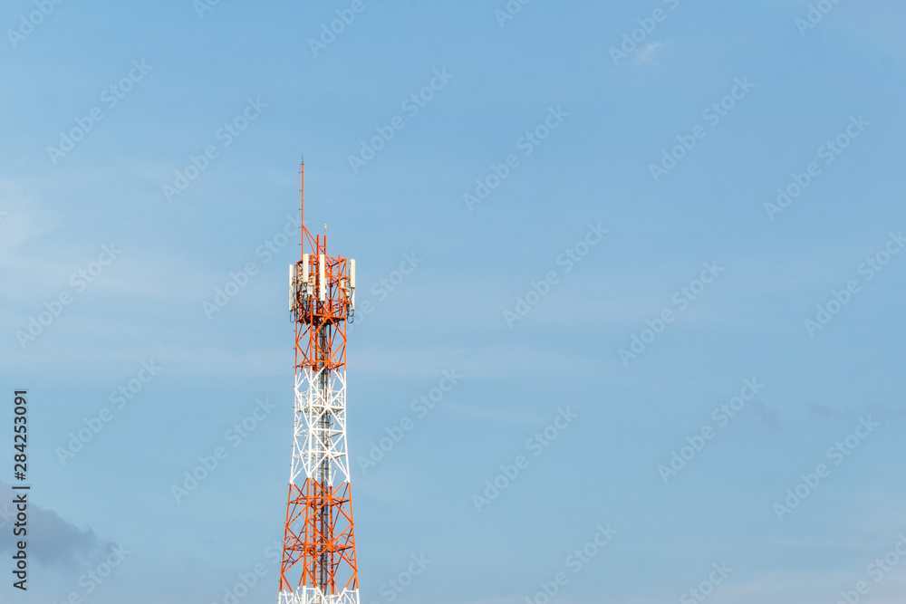 Telecommunication tower on shiny blue sky
