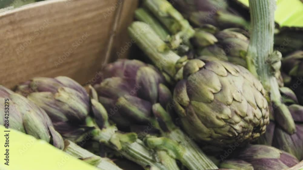 Someone's taking the artichoke. The chef is taking the artichoke out of the box now. The process of making artichokes. Someone's taking the artichoke. The chef is taking the artichoke out of the box now. The process of making artichokes.