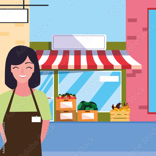 saleswoman with fruits store facade building