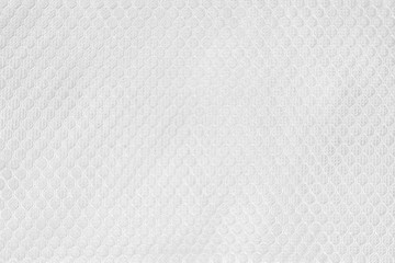 White fabric sport clothing football jersey with air mesh texture background. Seamless pattern of lines. Abstract background. Striped wallpaper. Shoes and clothing of mesh fabric texture design.