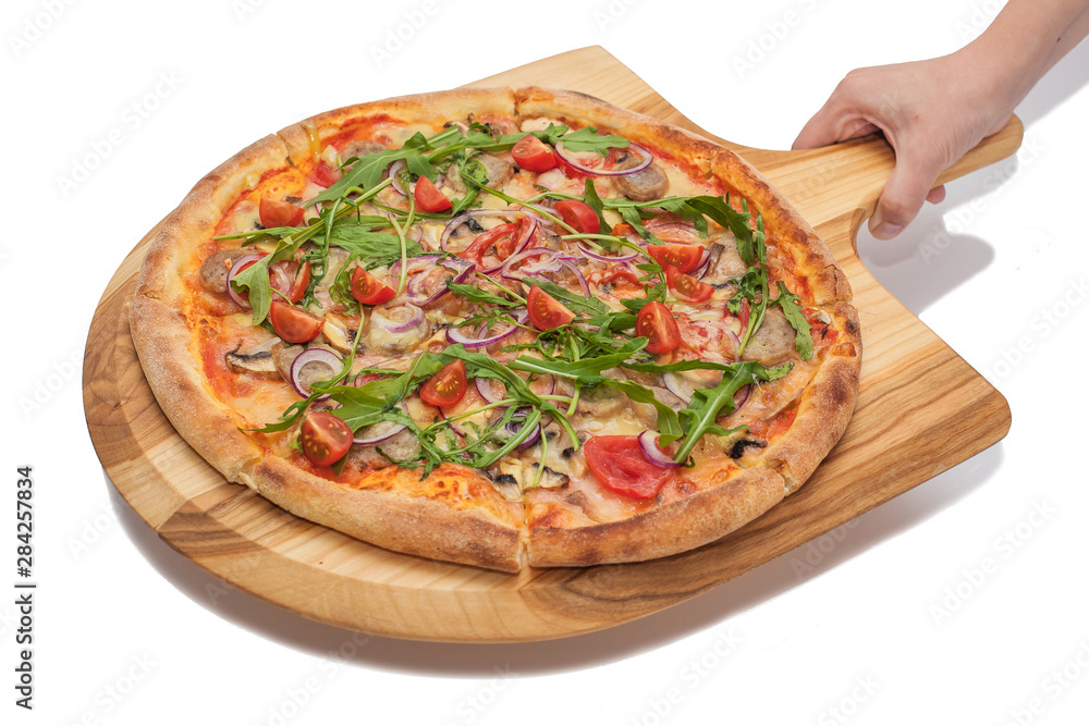 Food service concept - female hand holds a wooden board with pizza on a white background. Food service concept - female hand holds a wooden board with pizza on a white background.