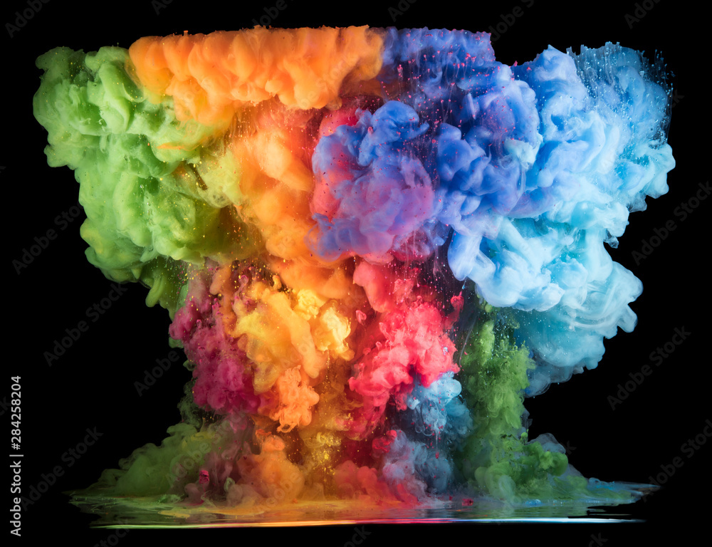 Colorful paint drops from above mixing in water. Ink swirling underwater. Colorful paint drops from above mixing in water. Ink swirling underwater.