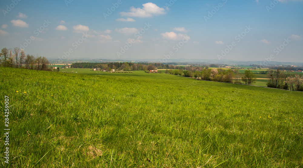 springtime rural scenery with meadows, fields, forest and dispersed settlement springtime rural scenery with meadows, fields, forest and dispersed settlement