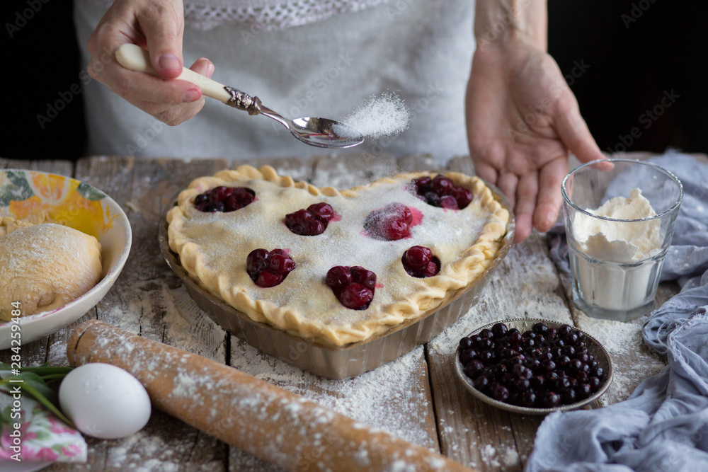 Cooking cherry pie. Work with the test.Bake a fruit cake in the shape of a heart. Delicious homemade cake do it yourself. Cooking. Valentine's Day. Heart shape. Ready for Valentine's Day.