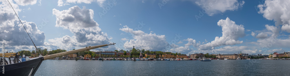 View over the Stockholm waterfront a summer day, with boats and houses. 