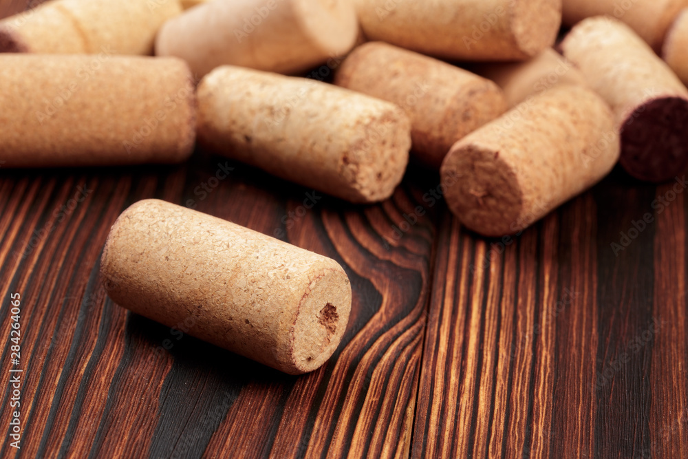 wine corks on a dark wooden background texture with a place for text.  - Image