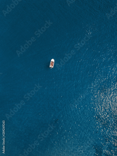 Single boat on a blue sea in Greece