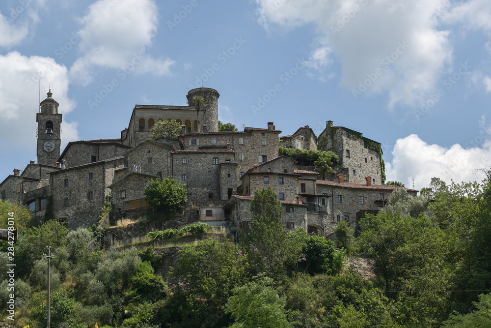 Castle of the family Malaspina at the village Bagnone against a blue sky, Tuscany, Italy