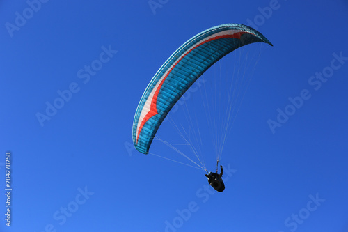 flying paraglider in sky