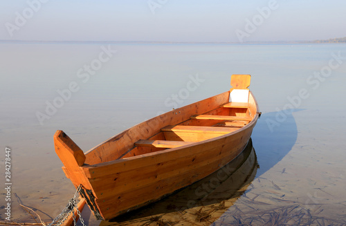 wooden boat on lake photo