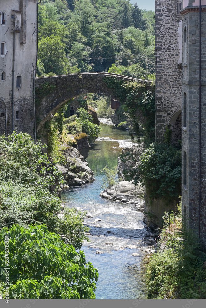Magra River with the ancient bridge in Bagnone, a small town in Tuscany, Italy