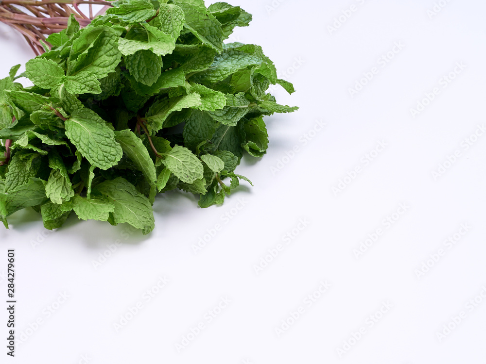 Fresh green mint leaves on white background Fresh green mint leaves on white background