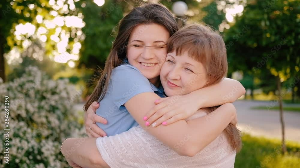 Mother day. Greeting happiness joy. Loving daughter hugging kissing mom smiling. Mother day. Greeting happiness joy. Loving daughter hugging kissing mom smiling.