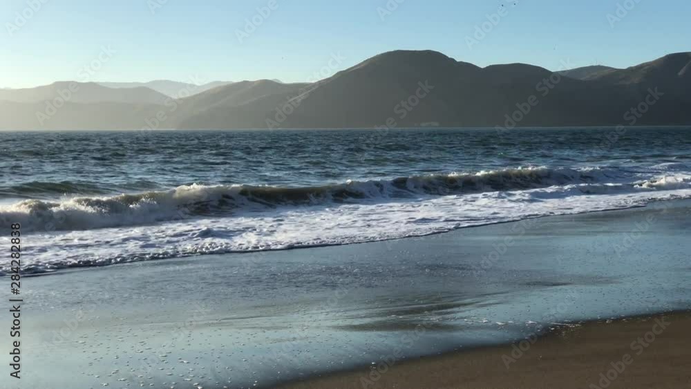 Ocean waves at sunset at Baker Beach, San Francisco, CA Ocean waves at sunset at Baker Beach, San Francisco, CA