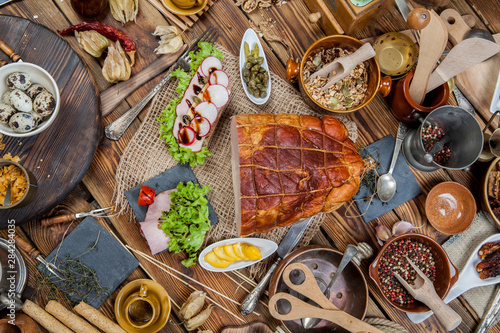 Smoked ham in a grid on a wooden table. (View from a different angle in the portfolio)