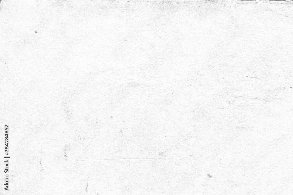 Cardboard white texture close-up. Light old paper background. Grunge concrete wall. Vintage blank wallpaper. Cardboard white texture close-up. Light old paper background. Grunge concrete wall. Vintage blank wallpaper.
