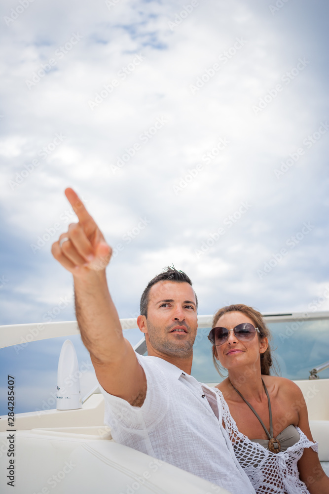 couple on their yacht at sea