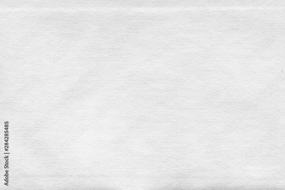 Fototapeta premium Cardboard white texture close-up. Light old paper background. Grunge concrete wall. Vintage blank wallpaper.