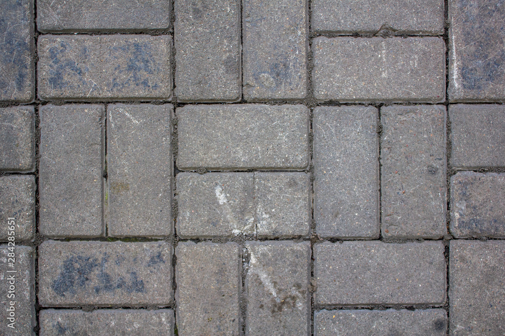gray shabby paving slabs of rectangular bricks. rough surface texture gray shabby paving slabs of rectangular bricks. rough surface texture