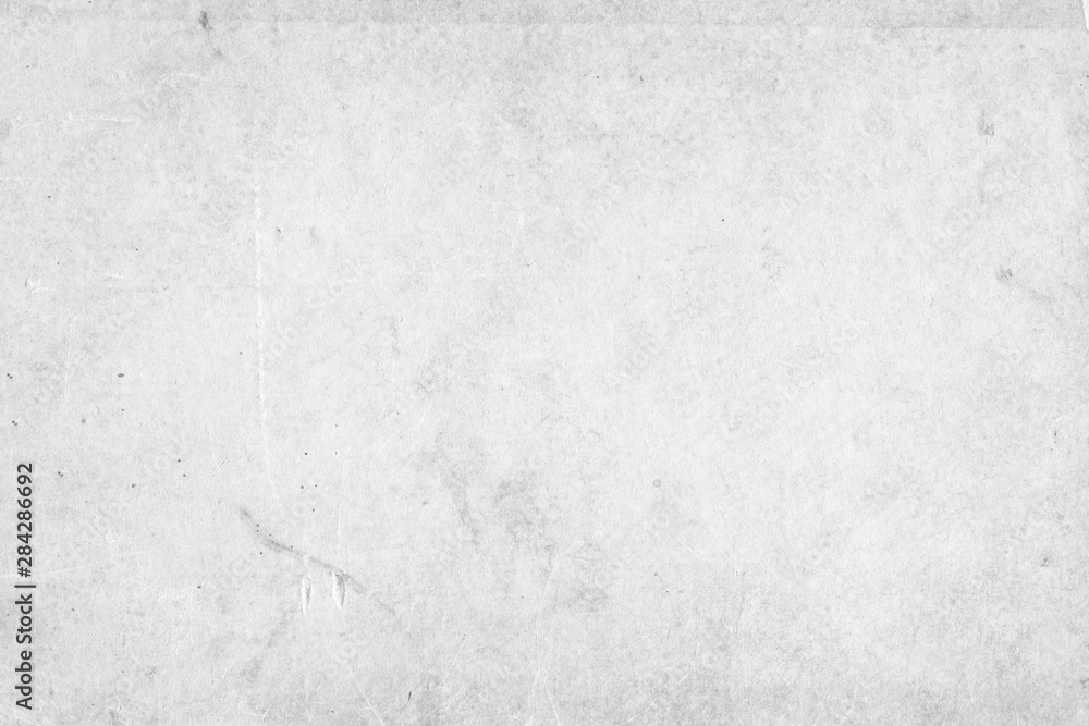 Cardboard white texture close-up. Light old paper background. Grunge concrete wall. Vintage blank wallpaper. Cardboard white texture close-up. Light old paper background. Grunge concrete wall. Vintage blank wallpaper.
