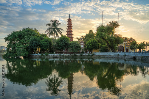 Hanoi cityscape at twilight. Tran Quoc pagoda, the oldest temple in Hanoi, Vietnam © Hanoi Photography