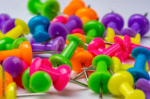 colored stationery buttons on a white background. Close-up photo