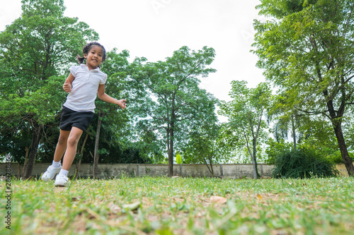 Asian baby girl smile and running in the garden