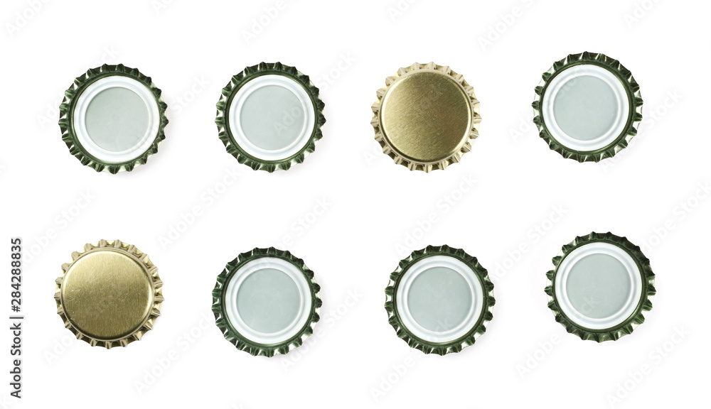 Set new golden bottle cap for beer isolated on white, top view, macro Set new golden bottle cap for beer isolated on white, top view, macro