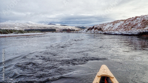 Canoeing on the River Brora in winter photo