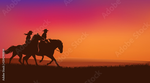 Fotografiet cowgirl and cowboy riding horses in romantic sunset prairie field - wild west ra