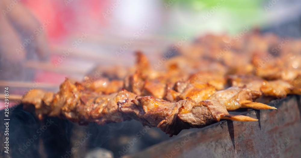 Skewers food, roast meat on the coals, the smoke is out of focus. Skewers food, roast meat on the coals, the smoke is out of focus.
