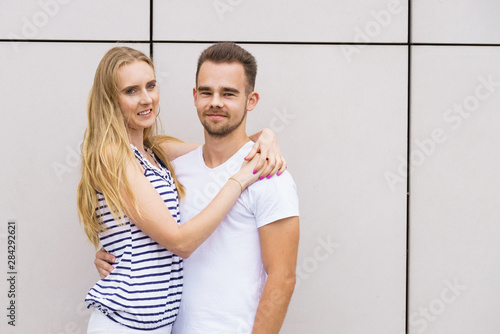 Blonde girl with her boyfriend outdoors.