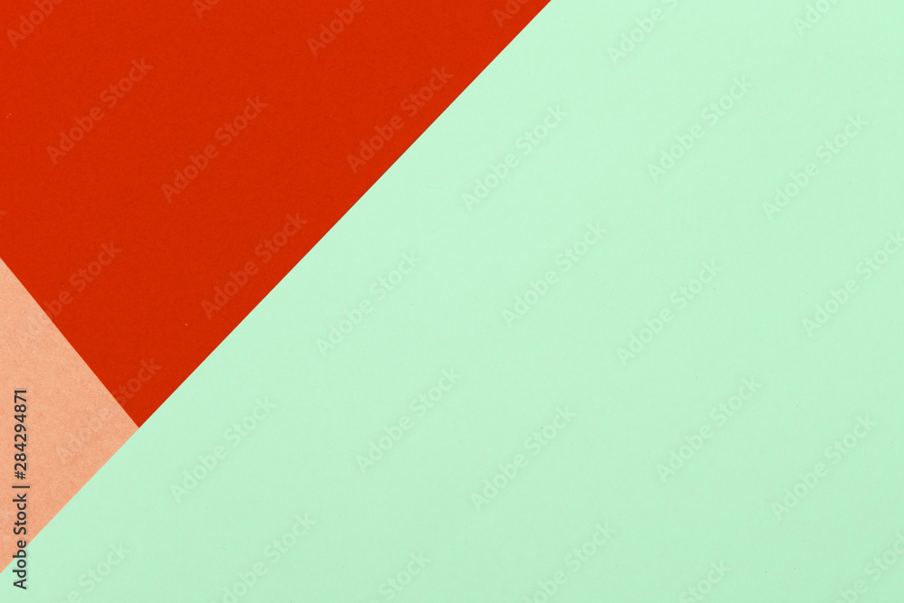 Paper red, orange, green, pastel empty background, geometrically located. Color blank for presentations, copy space.