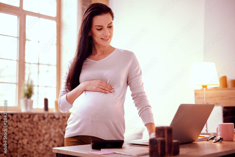 Pretty young girl demonstrating her abdomen on camera Pretty young girl demonstrating her abdomen on camera