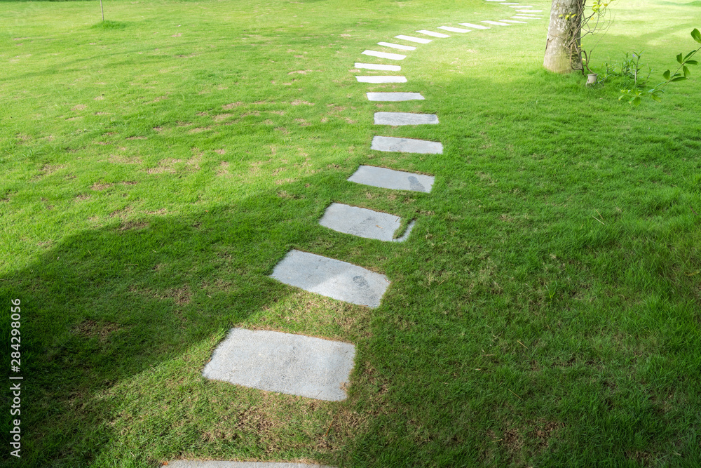 Stone paved path to the villa at tropical resort Stone paved path to the villa at tropical resort