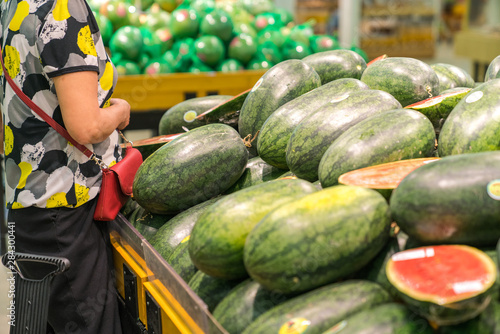Fresh healthy fruits on shelves in supermarket