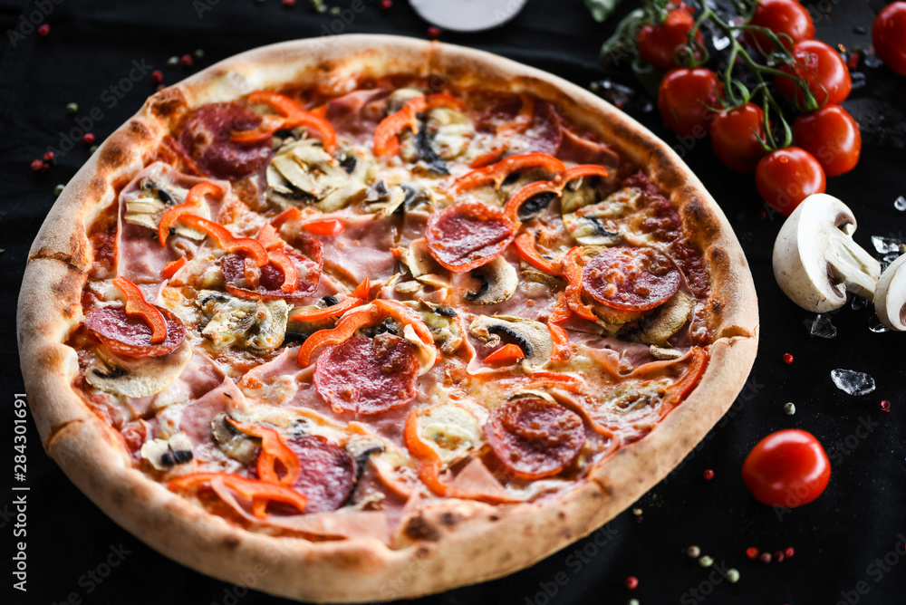 tasty italian capricciosa pizza with fresh ingredients